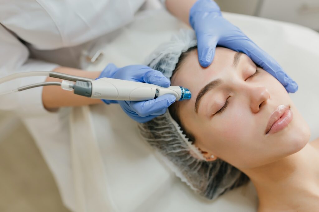 Closeup portrait of beautiful woman during cosmetology therapy in beauty salon. Professional dermato